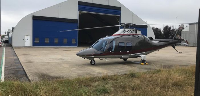 Apollo Air Services’ helicopter by the hangar at Cambridge City Airport