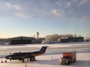 Gravel runways can be maintained during winter by allowing a thin layer of snow to freeze permanently on the surface