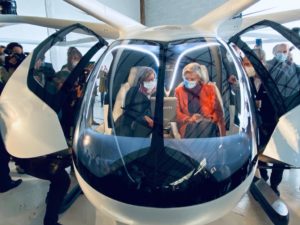 Visitors sit in the VoloCity eVTOL at a recent Groupe ADP event in Paris